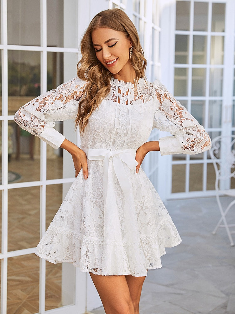 White lace long sleeve party dress with ribbon bow and hollow-out design, perfect for elegant weddings and special occasions.