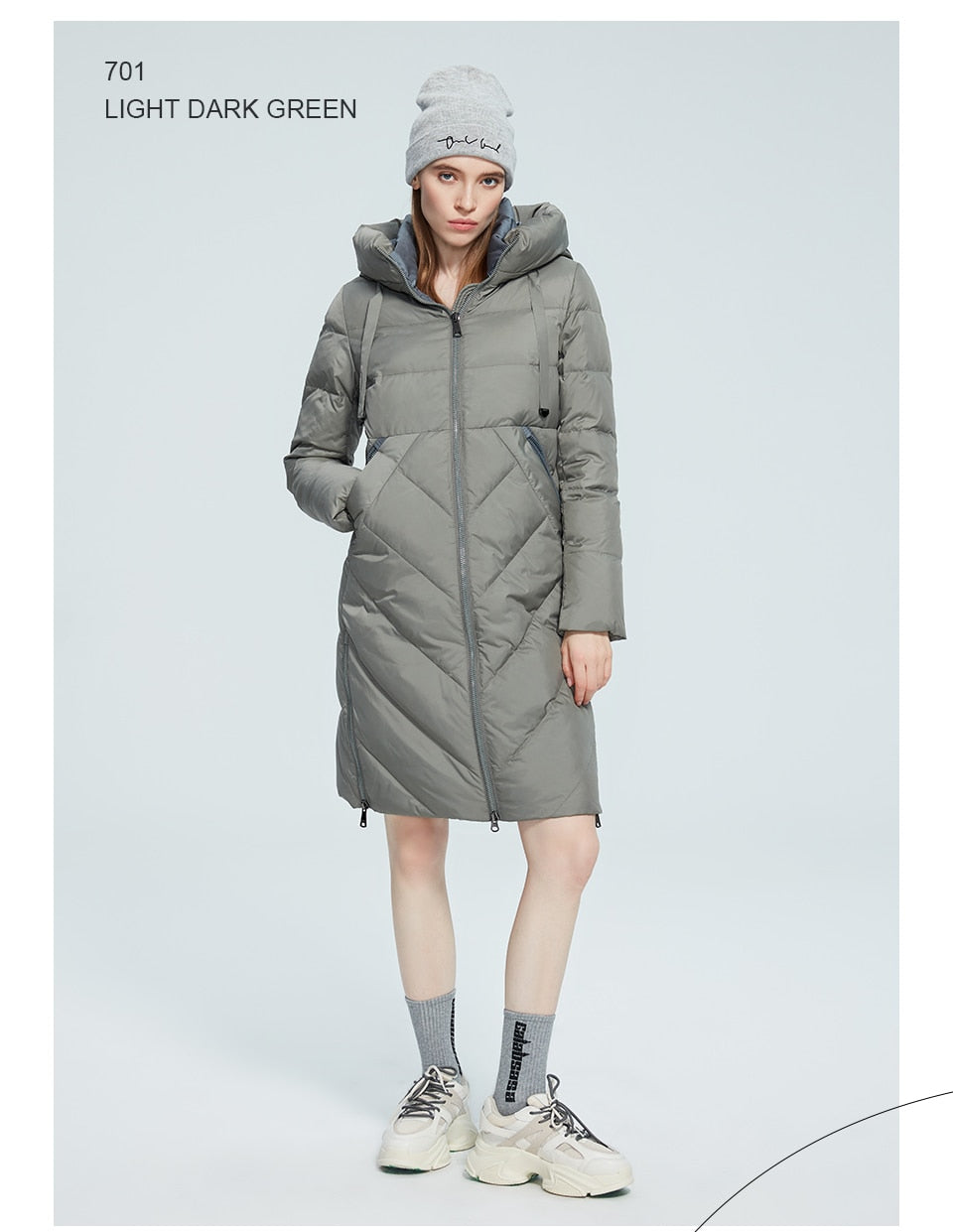 Women’s long cotton winter parka with stand collar, hood, zipper closure, pockets, and windproof design by The Clothing Company Sydney.