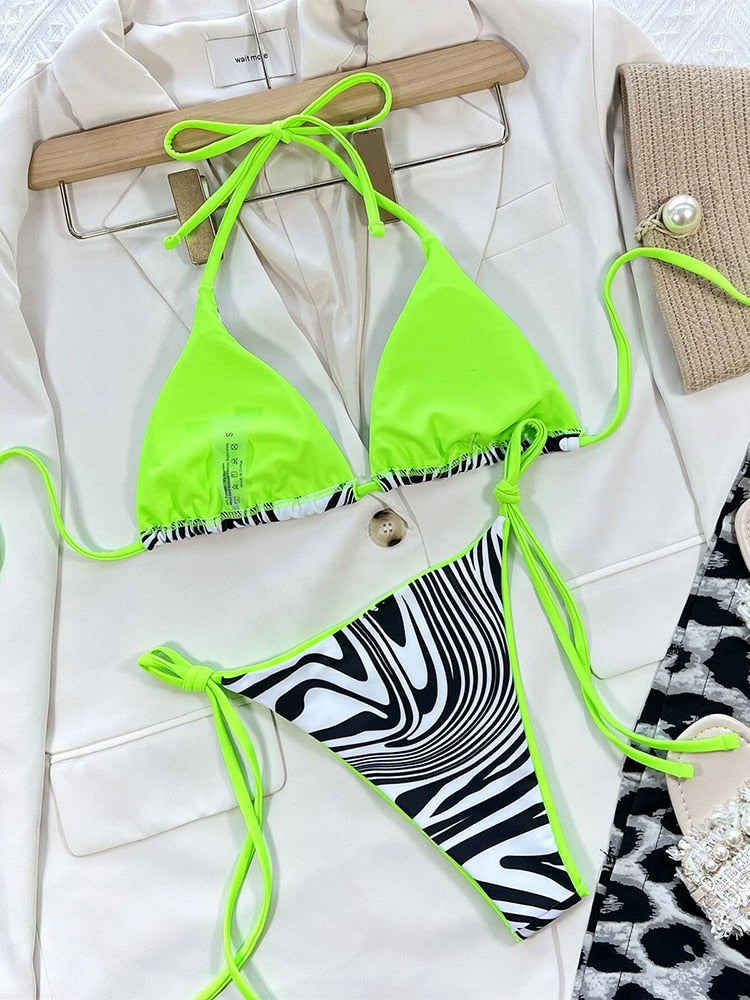 Leopard print bikini swimsuit by The Clothing Company Sydney featuring halter top and Brazilian cut beachwear.