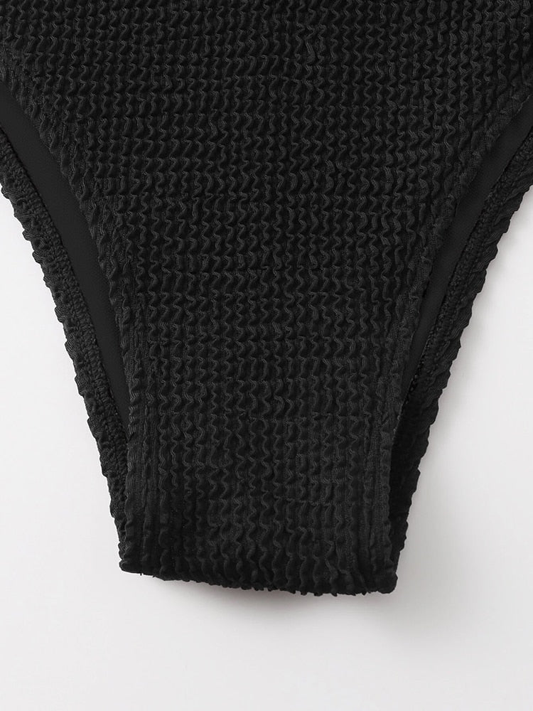 Metal ring textured bikini swimsuit by The Clothing Company Sydney featuring push-up design and bandage style, suitable for beach wear.