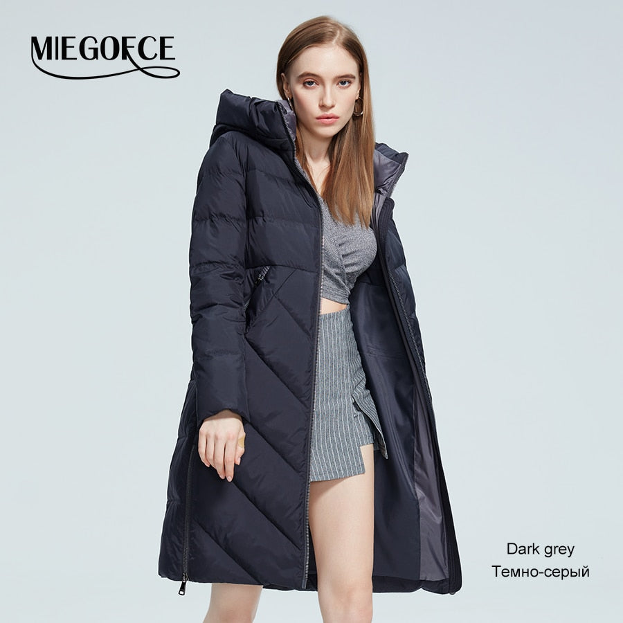Women’s long cotton winter jacket with stand collar, hood, zipper, and pockets from The Clothing Company Sydney.