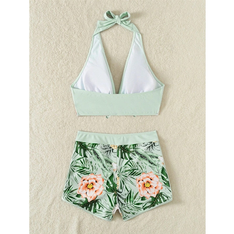 Two-piece swimsuit bikini top with lace print, high waist, halter neck, deep V-neck, and backless design from The Clothing Company Sydney.