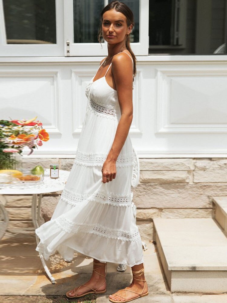 White spaghetti straps dress by The Clothing Company Sydney featuring a hollow-out design, soft fabric, split hem, perfect for summer.