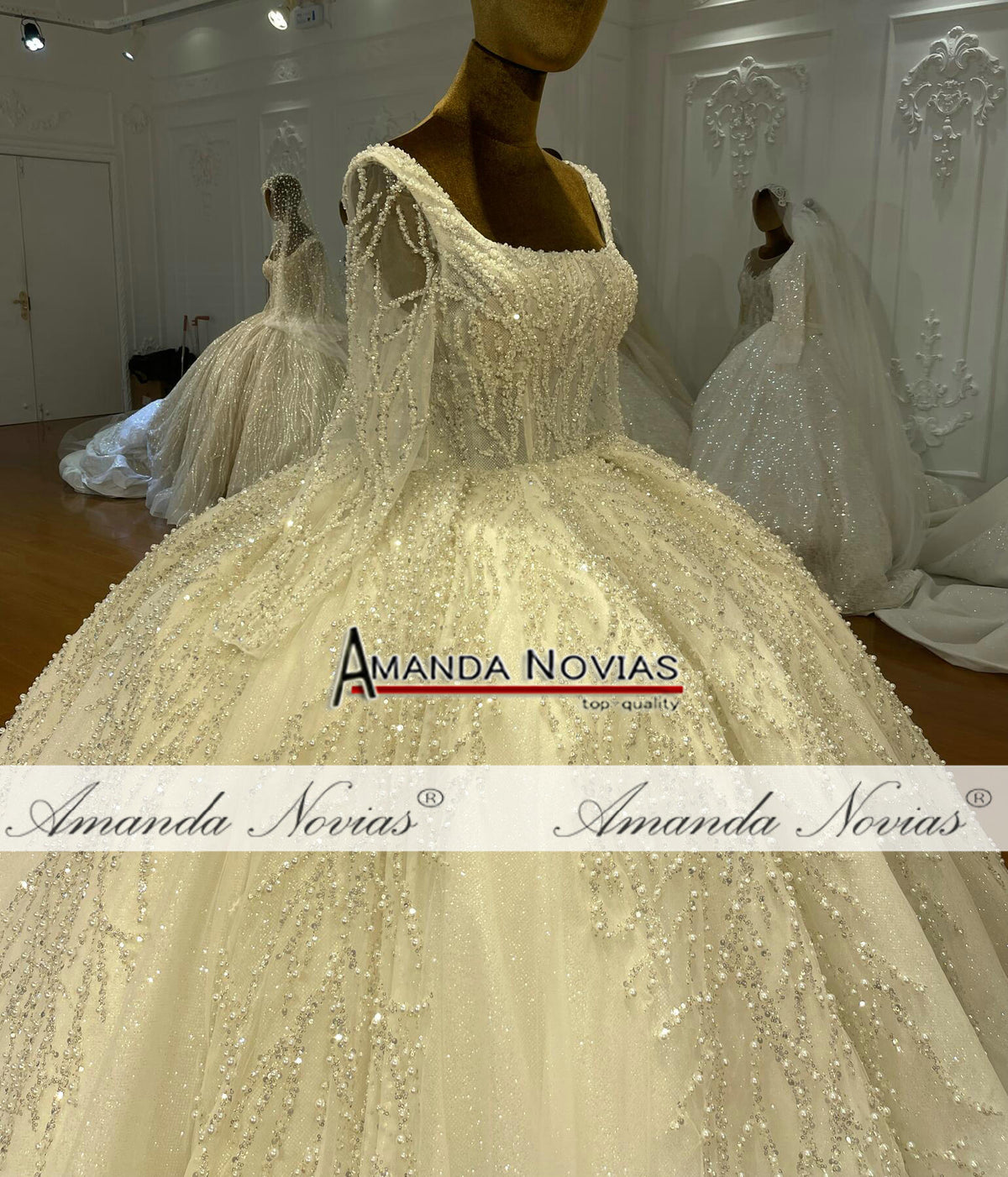 Luxury beaded long sleeve wedding dress by The Clothing Company Sydney, featuring intricate beadwork and elegant bridal design.