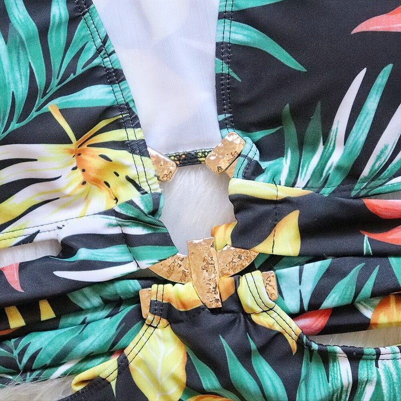 Hollow out floral one-piece swimsuit with cut-out design, metal decor, and push-up bodysuit style, perfect for beachwear.
