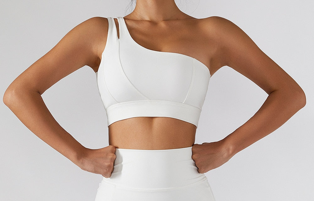 Women's yoga set with high waist leggings, skirt, and sports bra from The Clothing Company Sydney, perfect for gym workouts.
