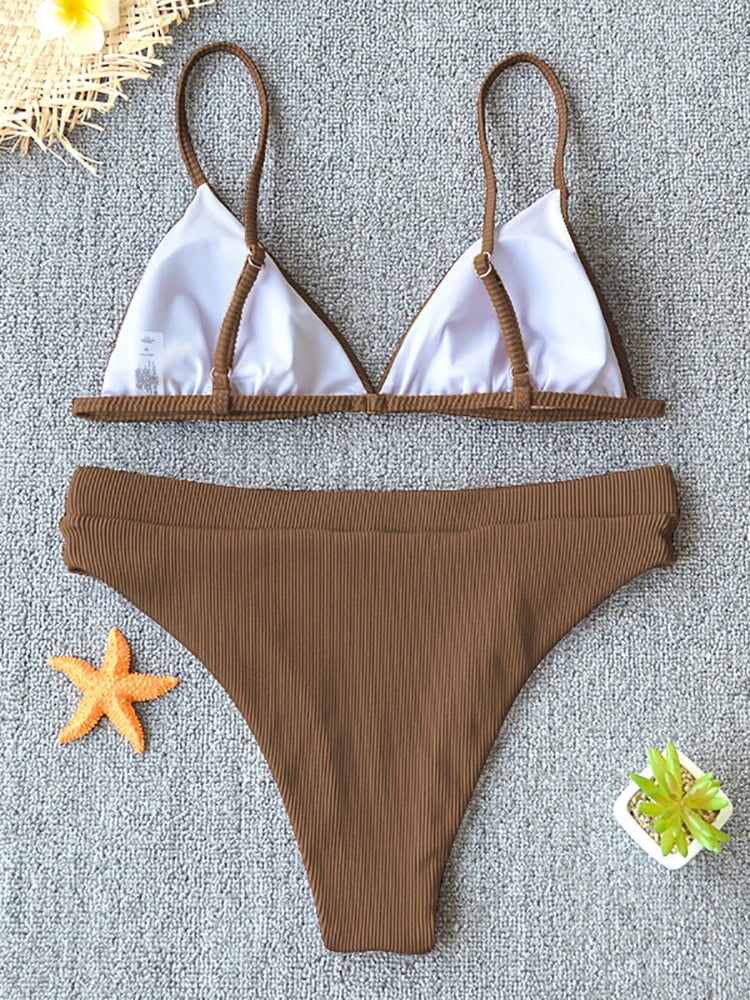 Black 2-piece metal rings micro bikini swimsuit with push-up top, Brazilian cut, stylish beachwear from The Clothing Company Sydney.