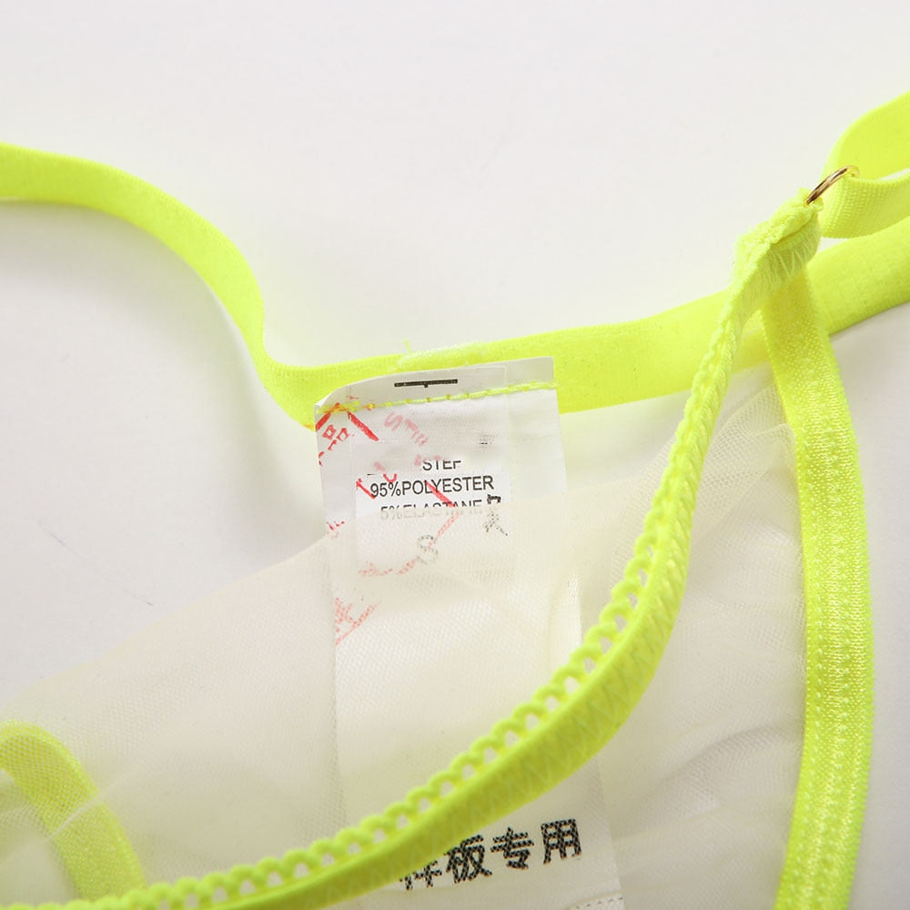 Transparent lingerie set by The Clothing Company Sydney featuring a seamless, see-through bra and panty, neon accents, 4-piece women's underwear set.