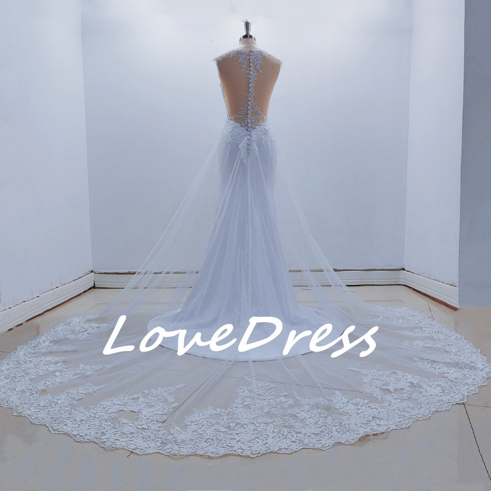 See-through back mermaid wedding dress with sleeveless lace appliques, designed for brides by The Clothing Company Sydney.