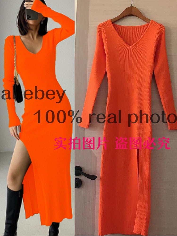 Slim fit long sleeve slit sweater dress by The Clothing Company Sydney featuring a hip-length knit design over the knee.