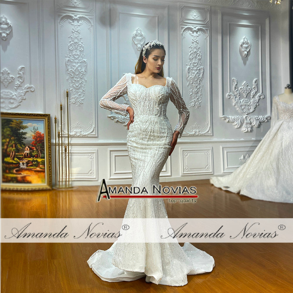 Two-in-one luxury mermaid wedding gown by The Clothing Company Sydney featuring intricate lace and satin fabric, fitted silhouette.