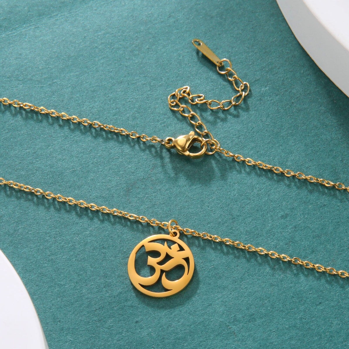 Stainless steel Tamil Om Aum symbol pendant with trident on chain, vintage Shiva yoga jewelry, natural and detailed design.