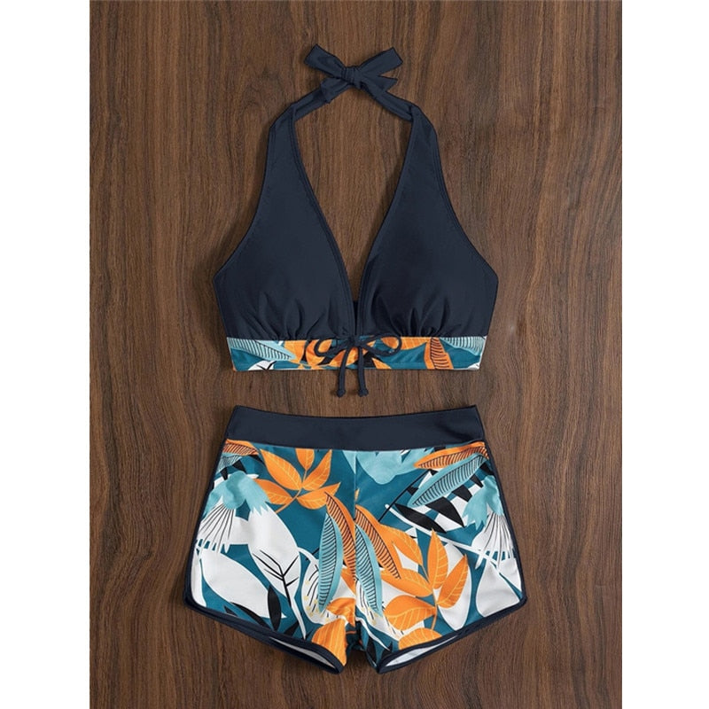 Two-piece swimsuit bikini set with lace print and solid color, featuring a high waist, halter neck, deep V-neck, and backless design.