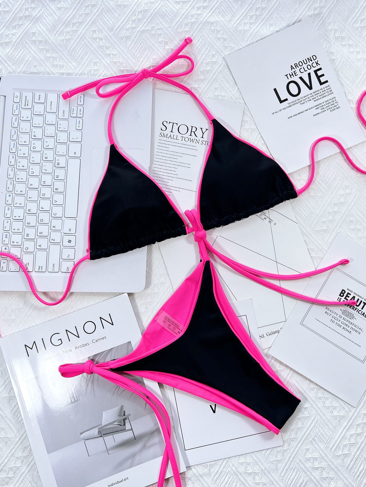 Two-piece halter bikini swimsuit with patchwork design and lace-up detail, perfect for summer beach and swimming activities.
