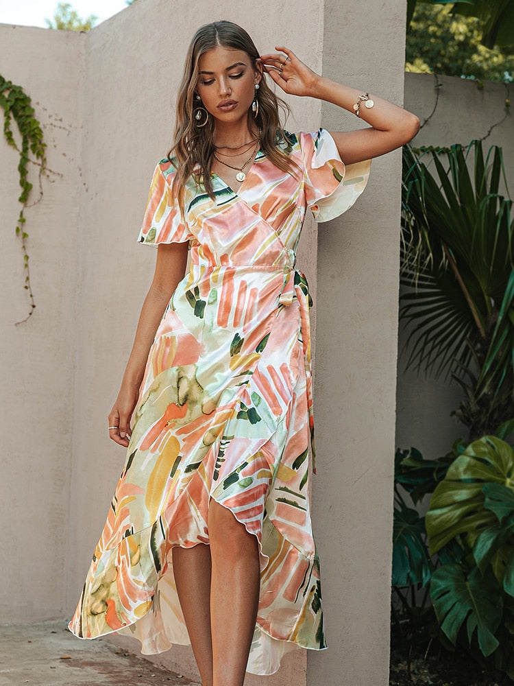 Leopard print party dress from The Clothing Company Sydney featuring V-neck, short sleeves, ruffled belt, and elegant split design.