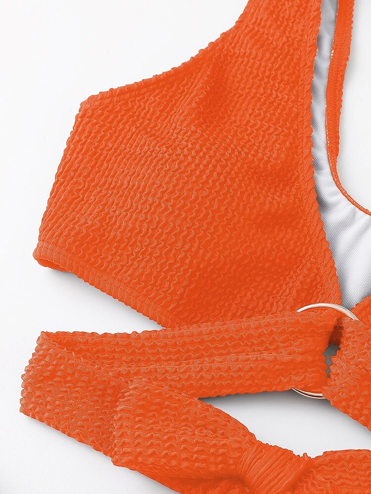 Metal ring textured bikini swimsuit from The Clothing Company Sydney featuring push-up design and bandage style for beach wear.
