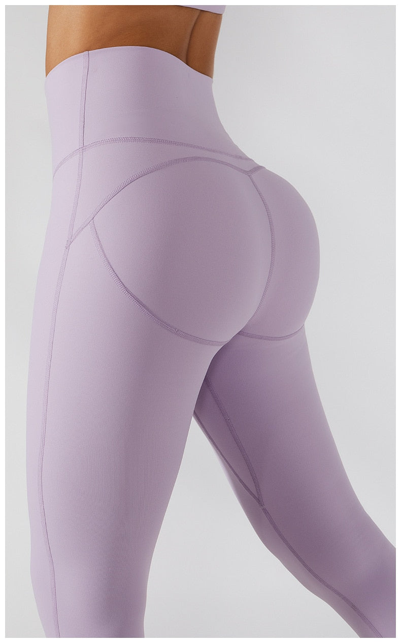 Women's yoga set with high waist leggings, skirt, and sports bra from The Clothing Company Sydney for gym and workout fitness.