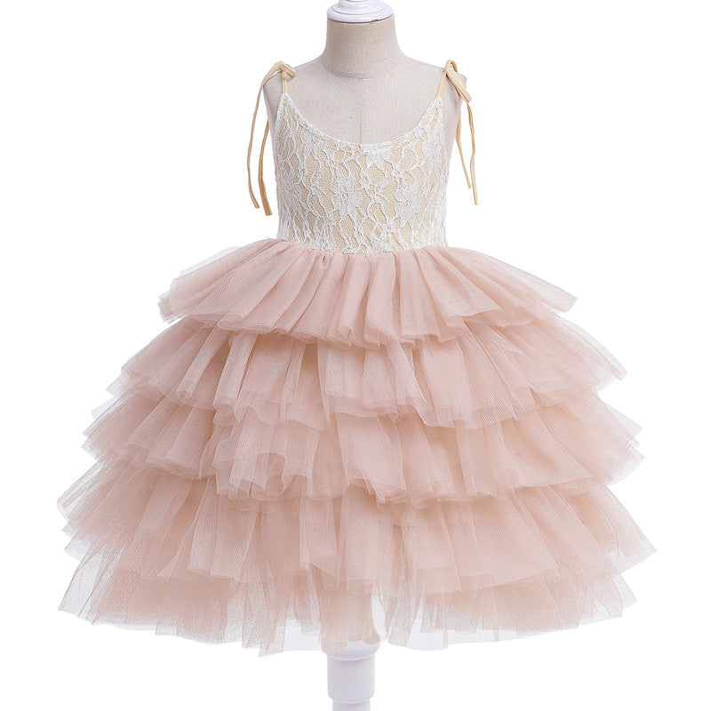 Young girl wearing a sleeveless layered princess Tulle dress with floral accents, perfect for summer beach or birthday parties.