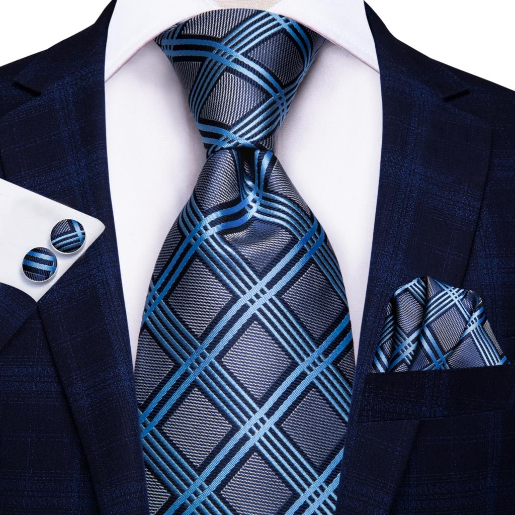Blue silk business tie with white dots and plaid pattern, paired with matching cufflinks, designed for weddings and formal occasions.