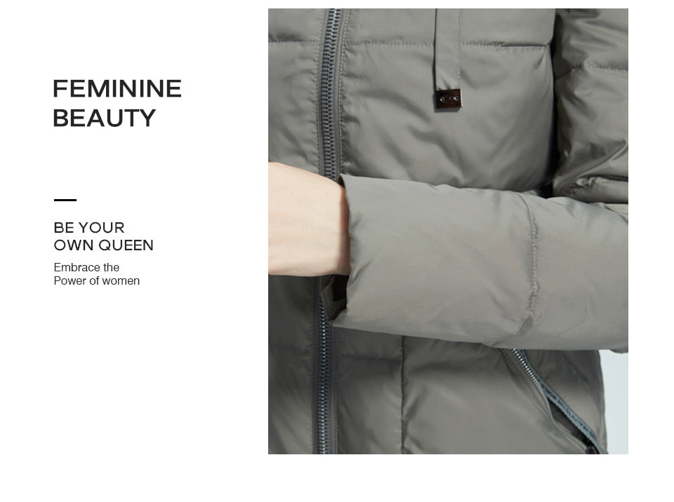Women's winter jacket by The Clothing Company Sydney featuring a stand collar, hood, large pockets, and windproof, mid-length design.