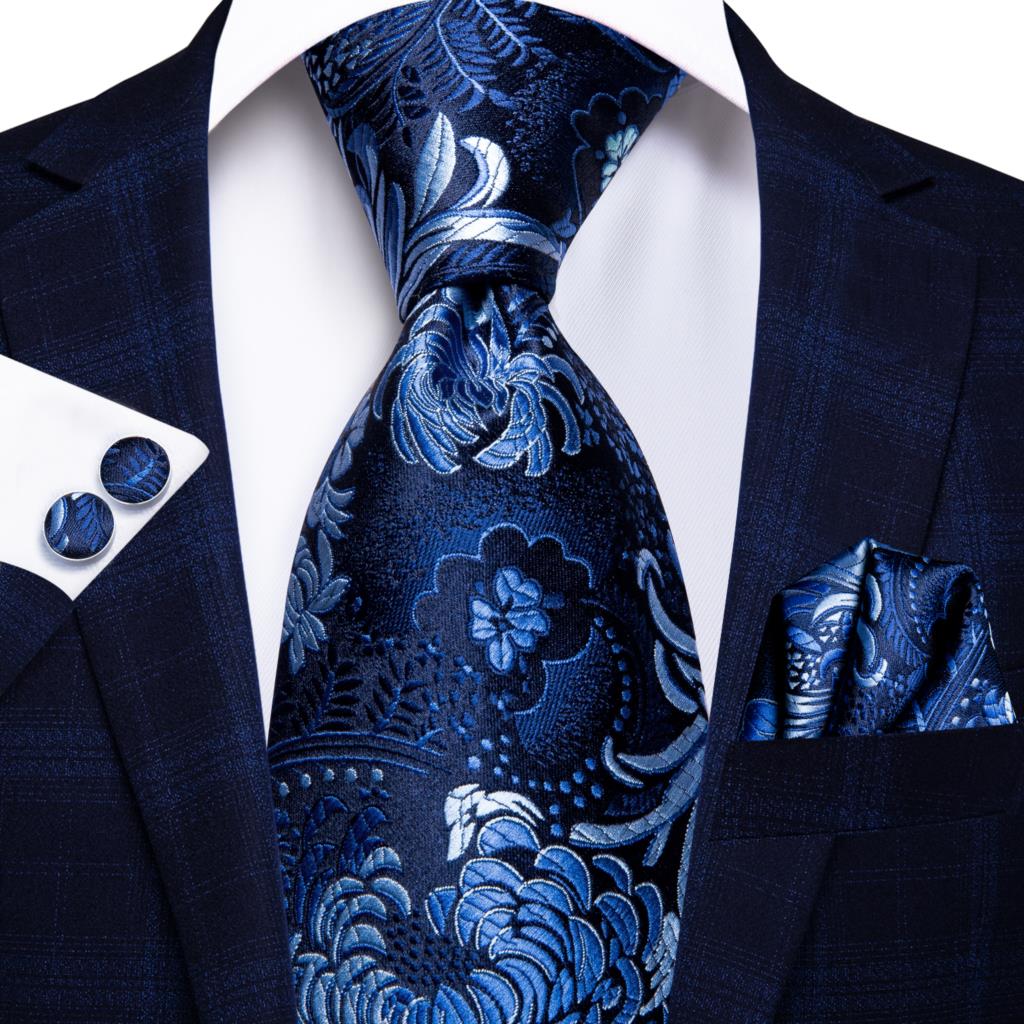 Blue silk business tie with dot pattern, plaid cufflinks, and matching accessories for men, suitable for weddings and business occasions.