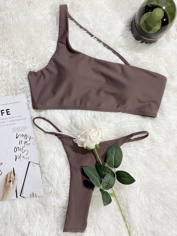 Asymmetric high cut micro thong bikini by The Clothing Company Sydney, featuring a two-piece swimsuit with string bather design.