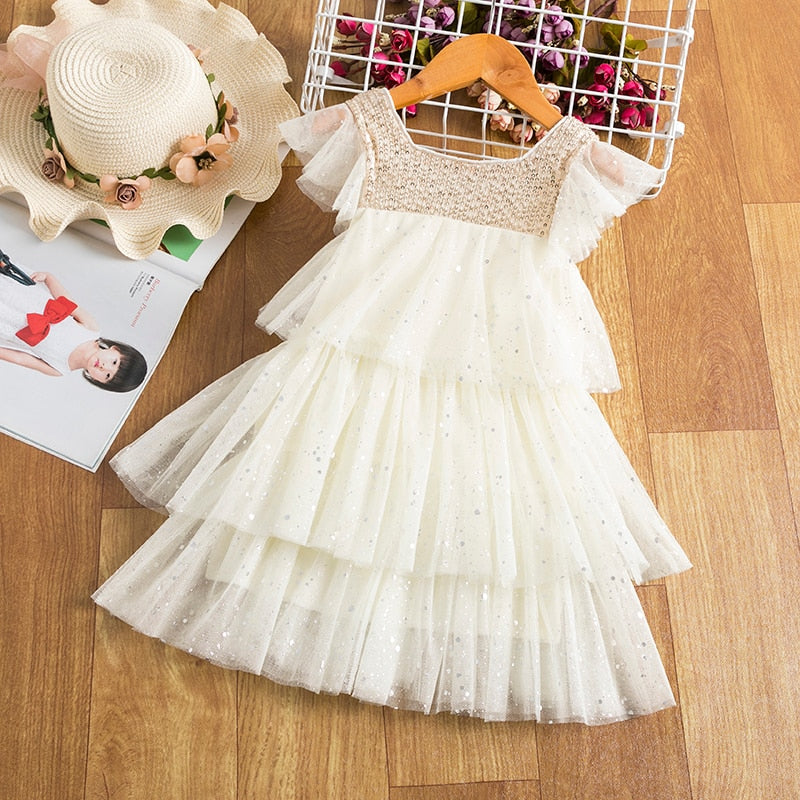 Kids summer princess beach dress by The Clothing Company Sydney featuring sleeveless layered tulle with floral accents and cake-themed details.