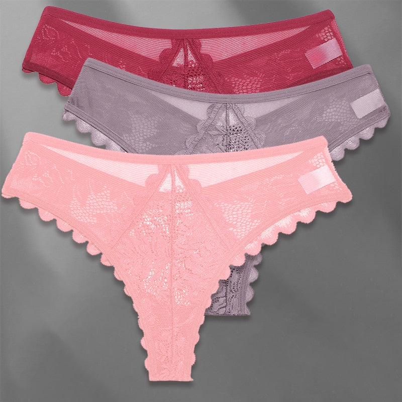 Three lace G-string panties from The Clothing Company Sydney, soft feminine lingerie with thin straps and delicate lace details.