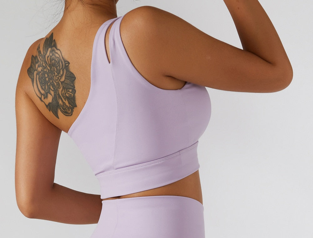 Women’s yoga set with high waist leggings, skirt, and sports bra from The Clothing Company Sydney, perfect for gym and fitness workouts.