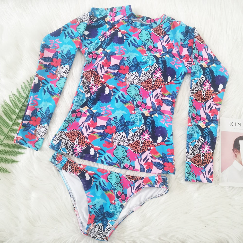 Long sleeve floral print bikini swimsuit by The Clothing Company Sydney, two-piece tankini set with long sleeves and vibrant floral design.