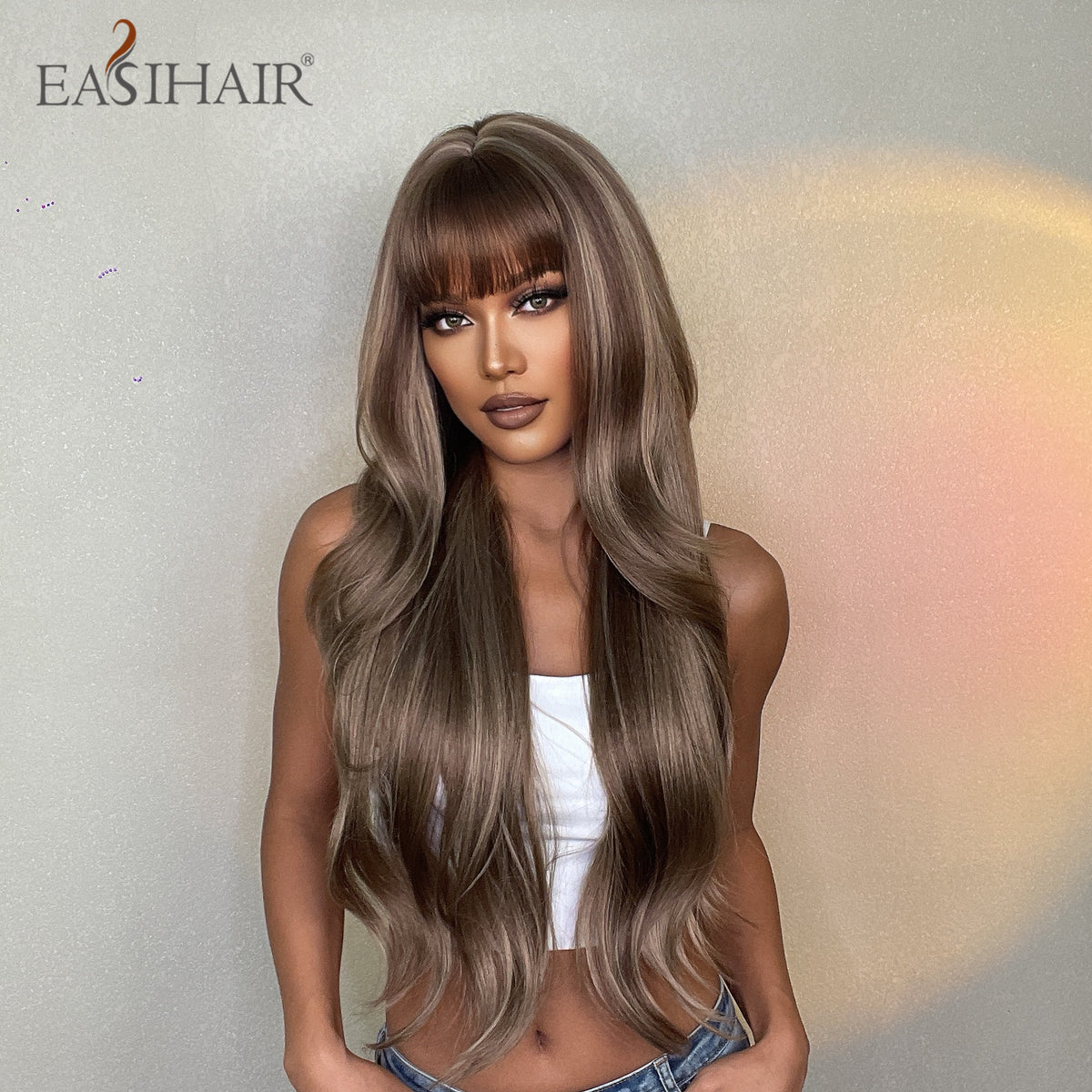 Long wavy synthetic wig for women with brown and blonde highlights, heat-resistant, natural look, suitable for daily wear or cosplay.