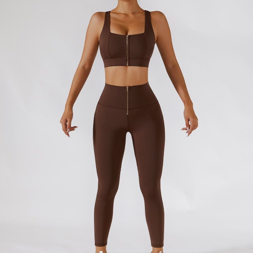 Two-piece women's yoga set by The Clothing Company Sydney featuring high waist leggings, skirt, and zipper sports bra for gym workouts.