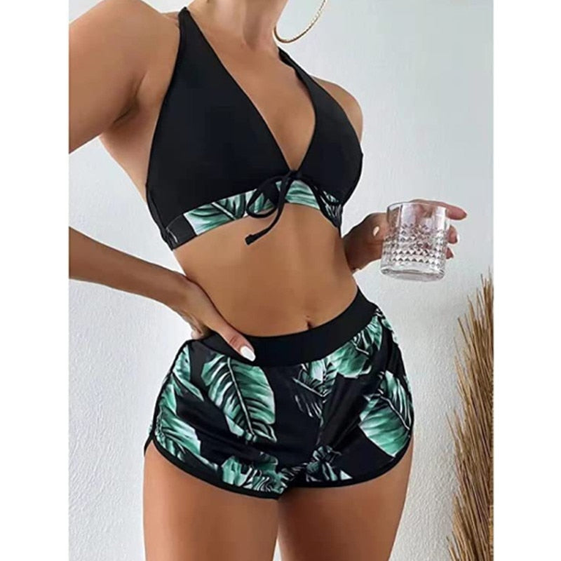 Two-piece swimsuit bikini set with lace print, high waist, halter neck, deep V-neck, and backless design by The Clothing Company Sydney.