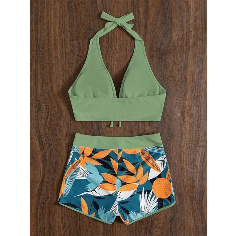 Two-piece swimsuit bikini top with lace print, high waist, halter neck, deep V-neck, and backless design by The Clothing Company Sydney.