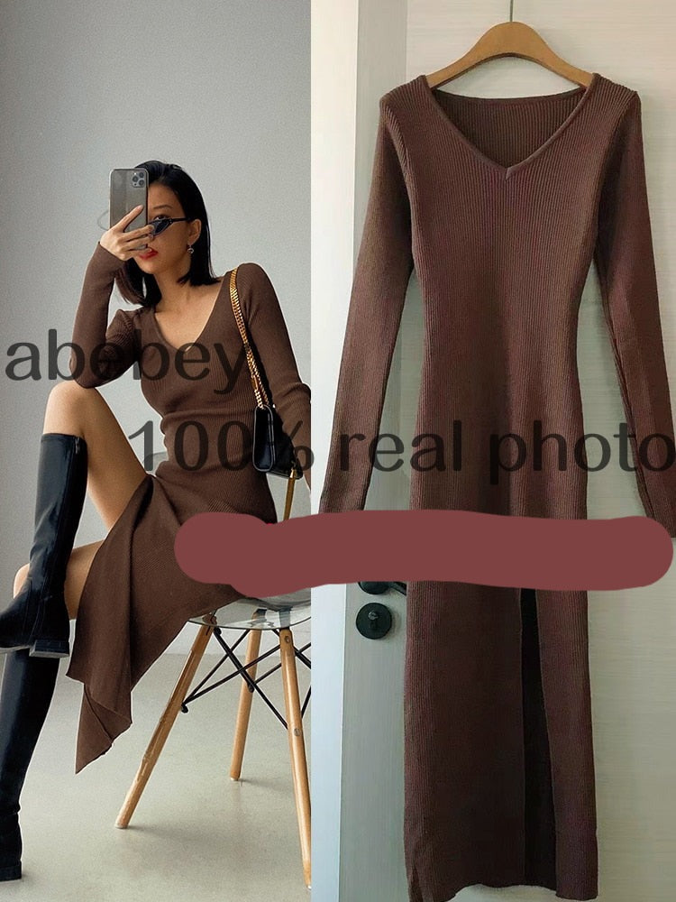Slim fitted long sleeve slit sweater dress by The Clothing Company Sydney, featuring a hip-length knit design over the knee.
