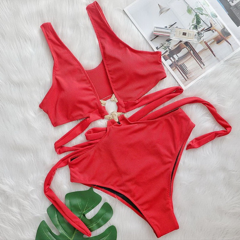 Hollow out floral one-piece swimsuit by The Clothing Company Sydney with cut-outs, metal accents, and push-up design for beachwear.