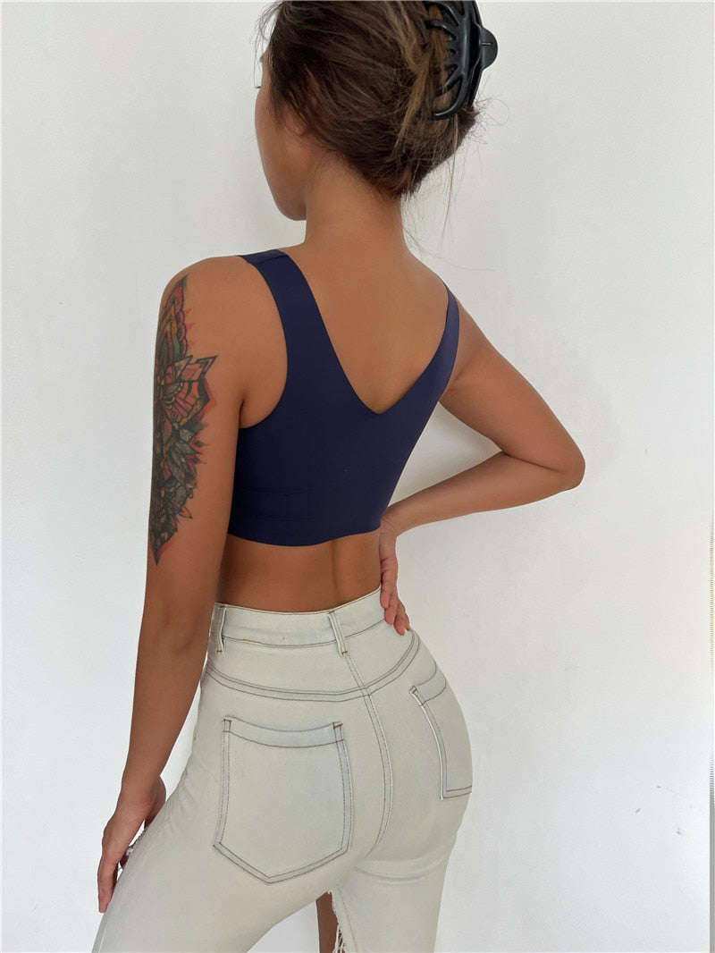 Seamless sports bra and plunge bralette by The Clothing Company Sydney, featuring deep V neckline, push-up pads, and lightweight lingerie.