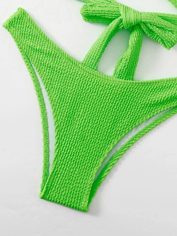 Textured metal ring bikini swimsuit from The Clothing Company Sydney featuring a push-up style and bandage design for beachwear.