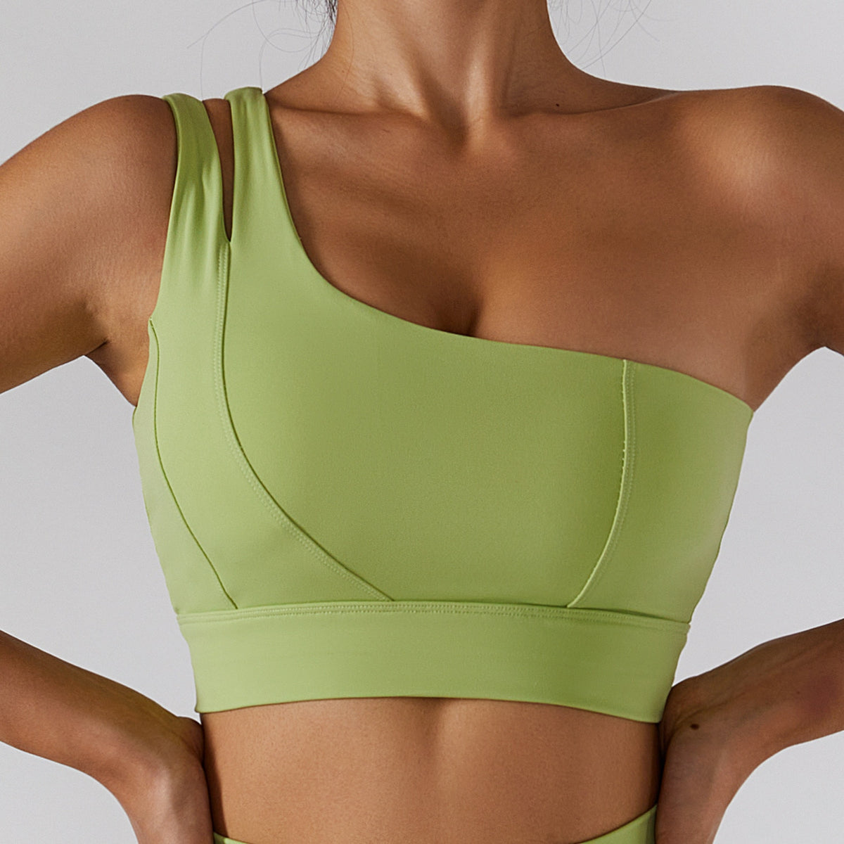 Women's yoga set by The Clothing Company Sydney with high waist leggings, a skirt overlay, and a zipper sport bra for gym workouts.