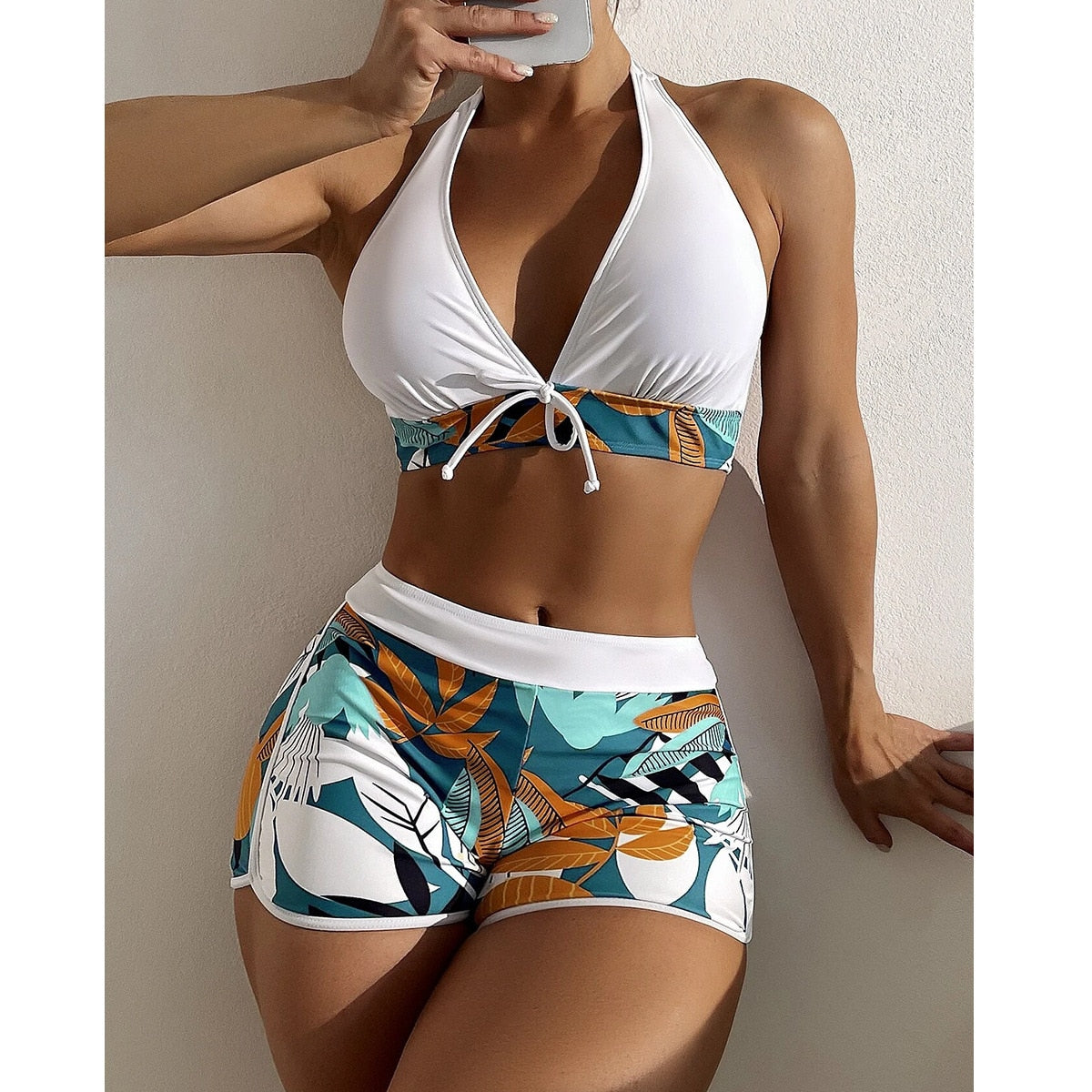 Two-piece swimsuit bikini set with lace print, high waist, halter neck, deep V-neck, backless design, push-up style by The Clothing Company Sydney