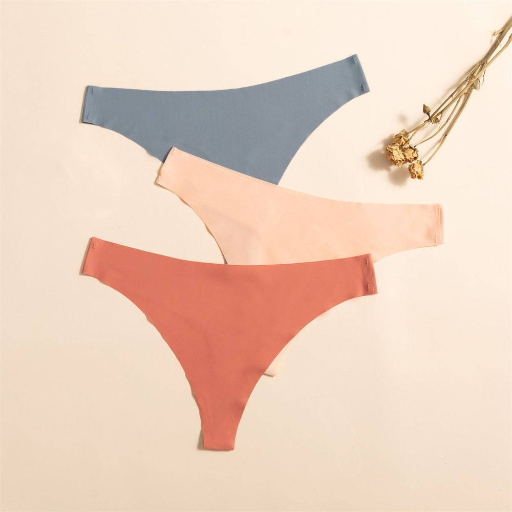 Three packs of seamless, ultra-thin women's G-string panties in solid colors from The Clothing Company Sydney, featuring comfortable lingerie.