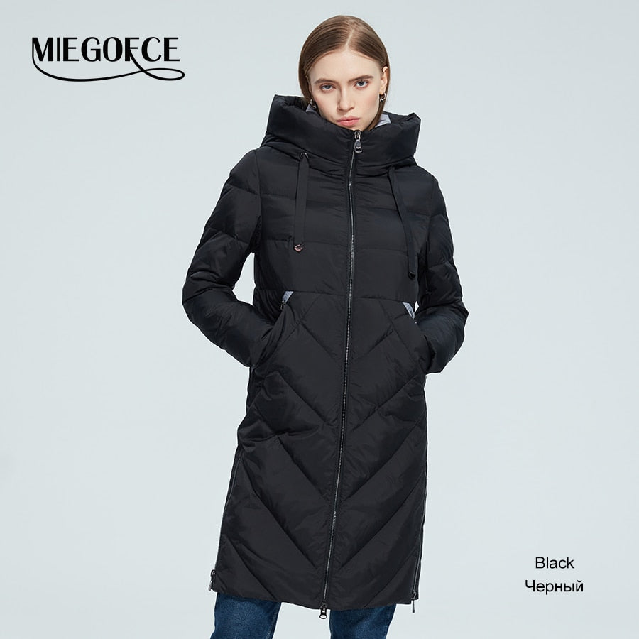 Warm women's long cotton winter jacket with stand collar, hood, zipper, pockets, windproof design, from The Clothing Company Sydney.