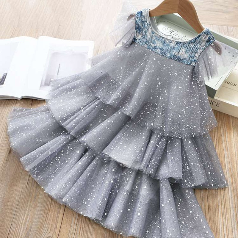 Kids' summer princess dress by The Clothing Company Sydney featuring sleeveless layered tulle, floral accents, perfect for beach or birthday parties.
