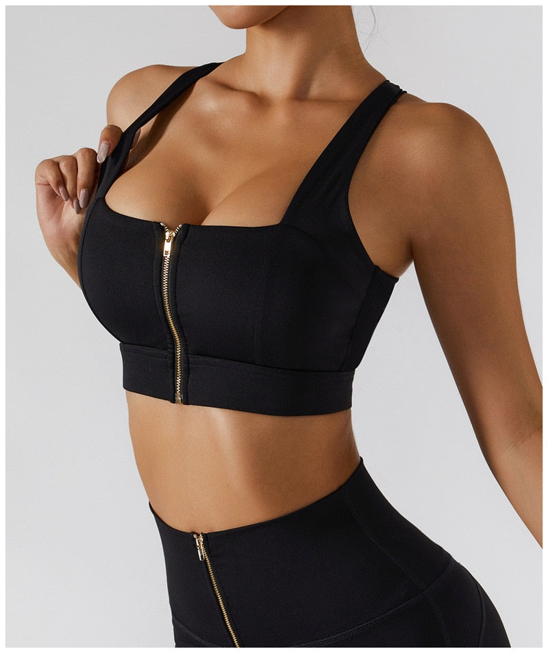 Women's yoga set from The Clothing Company Sydney featuring high waist leggings, a skirt, and a zipper sports bra for fitness.