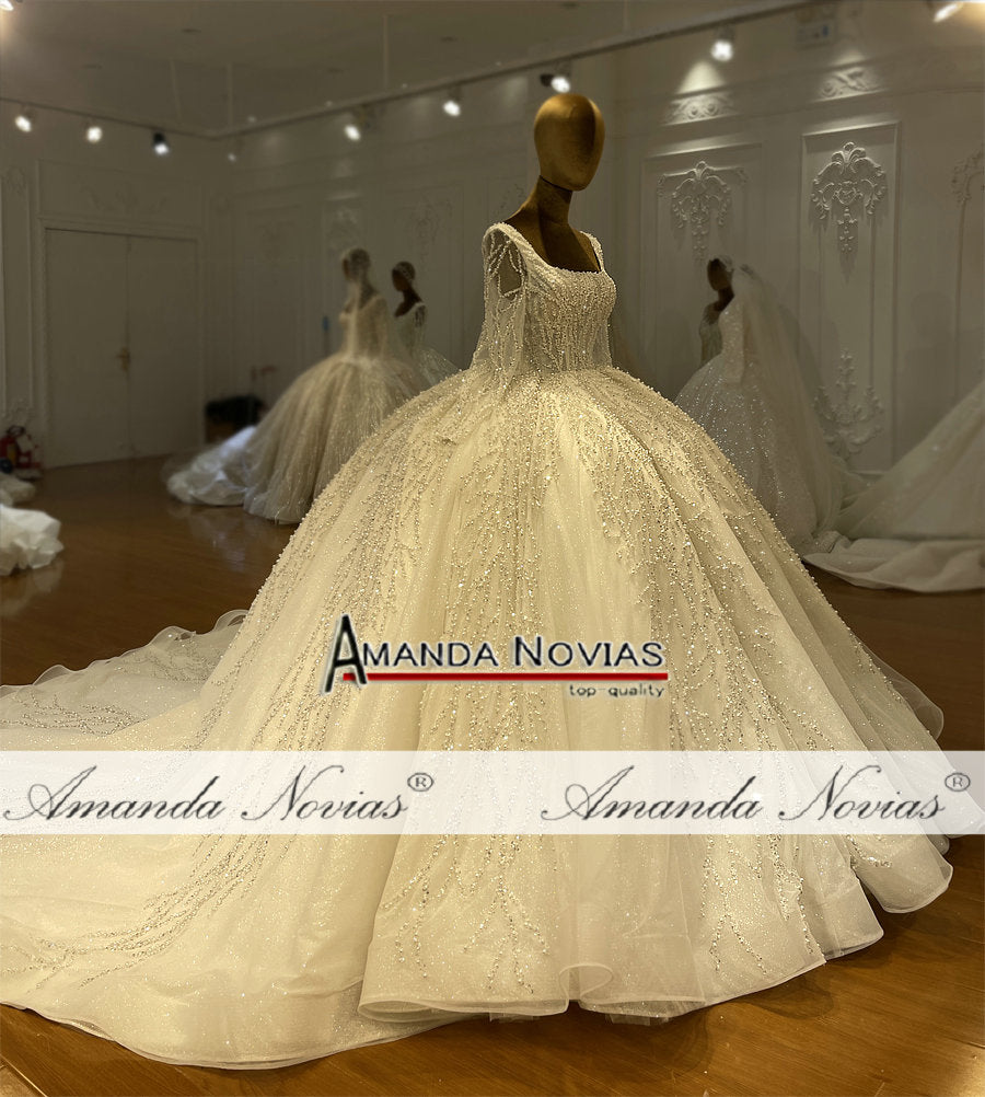 Long sleeve luxury beaded bridal wedding dress by The Clothing Company Sydney, featuring intricate beadwork and elegant design.