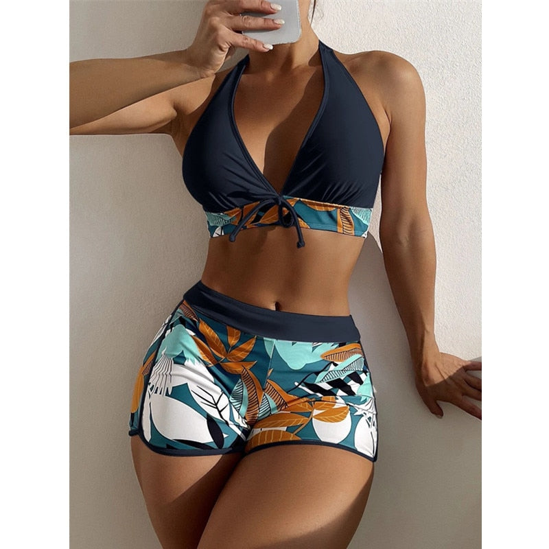 Two-piece swimsuit bikini set with lace print, high waist, halter neck, deep V-neck, backless design, by The Clothing Company Sydney.