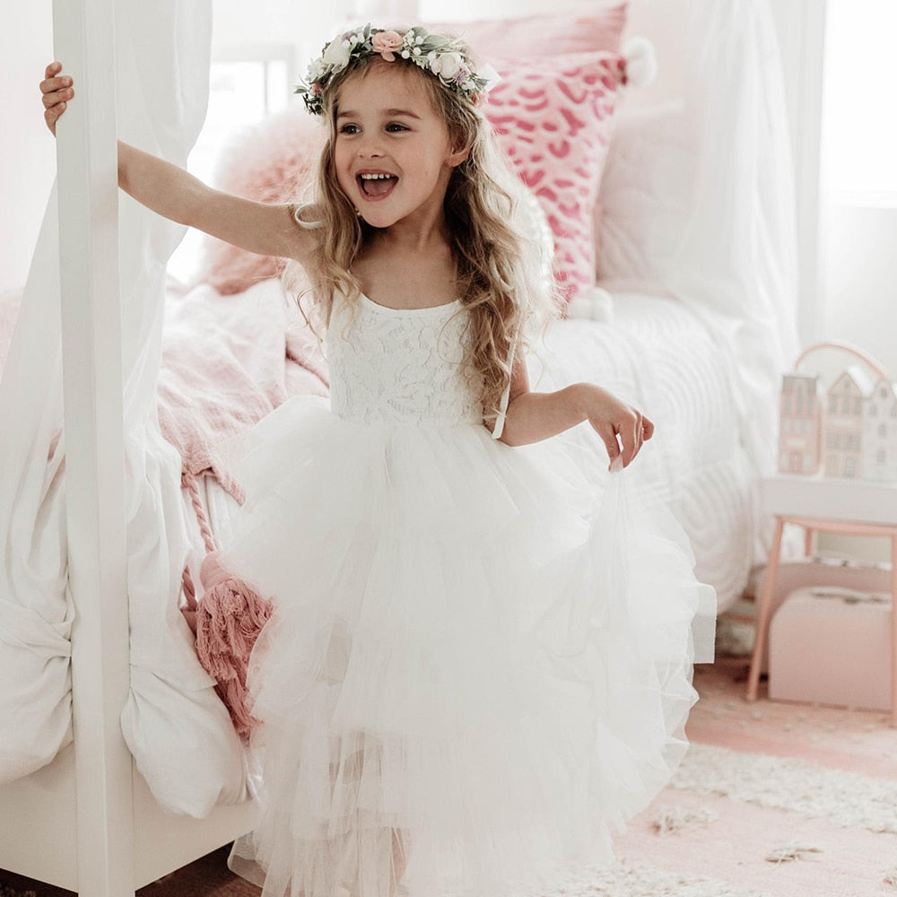 Kids girls summer princess beach dress by The Clothing Company Sydney featuring sleeveless layered tulle with cake flower details.