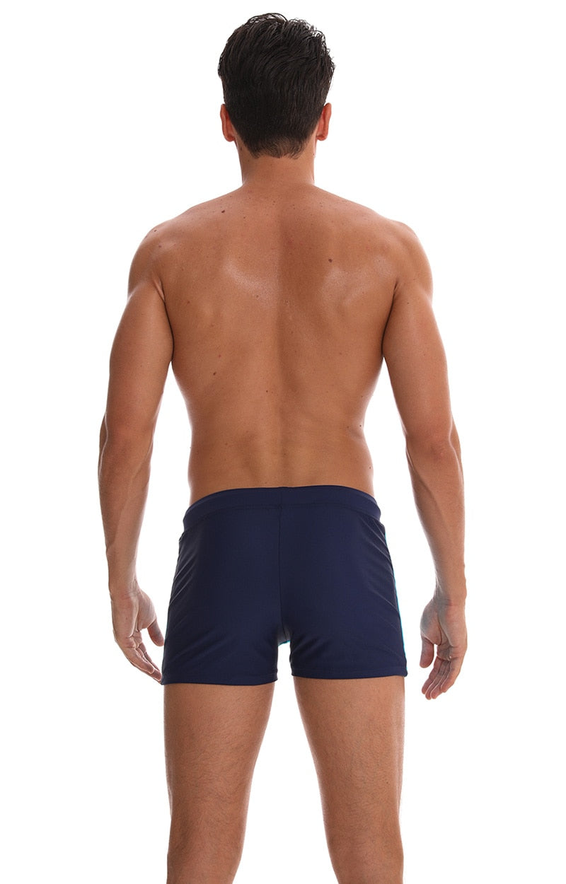 Men's breathable swim trunks by The Clothing Company Sydney, featuring quick-dry fabric and a comfortable fit for beach or pool.