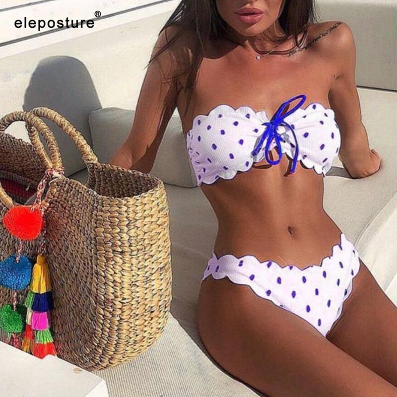 Polka dot two-piece swimsuit by The Clothing Company Sydney featuring floral side panels, push-up style, perfect for beachwear.