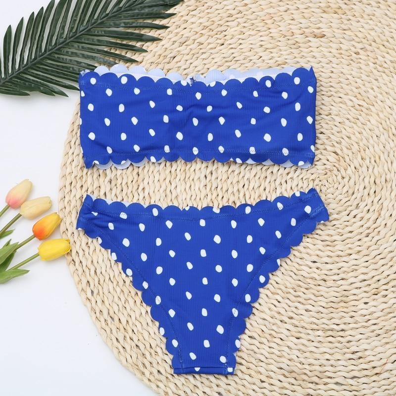 Polka dot two-piece swimsuit by The Clothing Company Sydney with floral accents, push-up style, Brazilian cut, perfect for beachwear.
